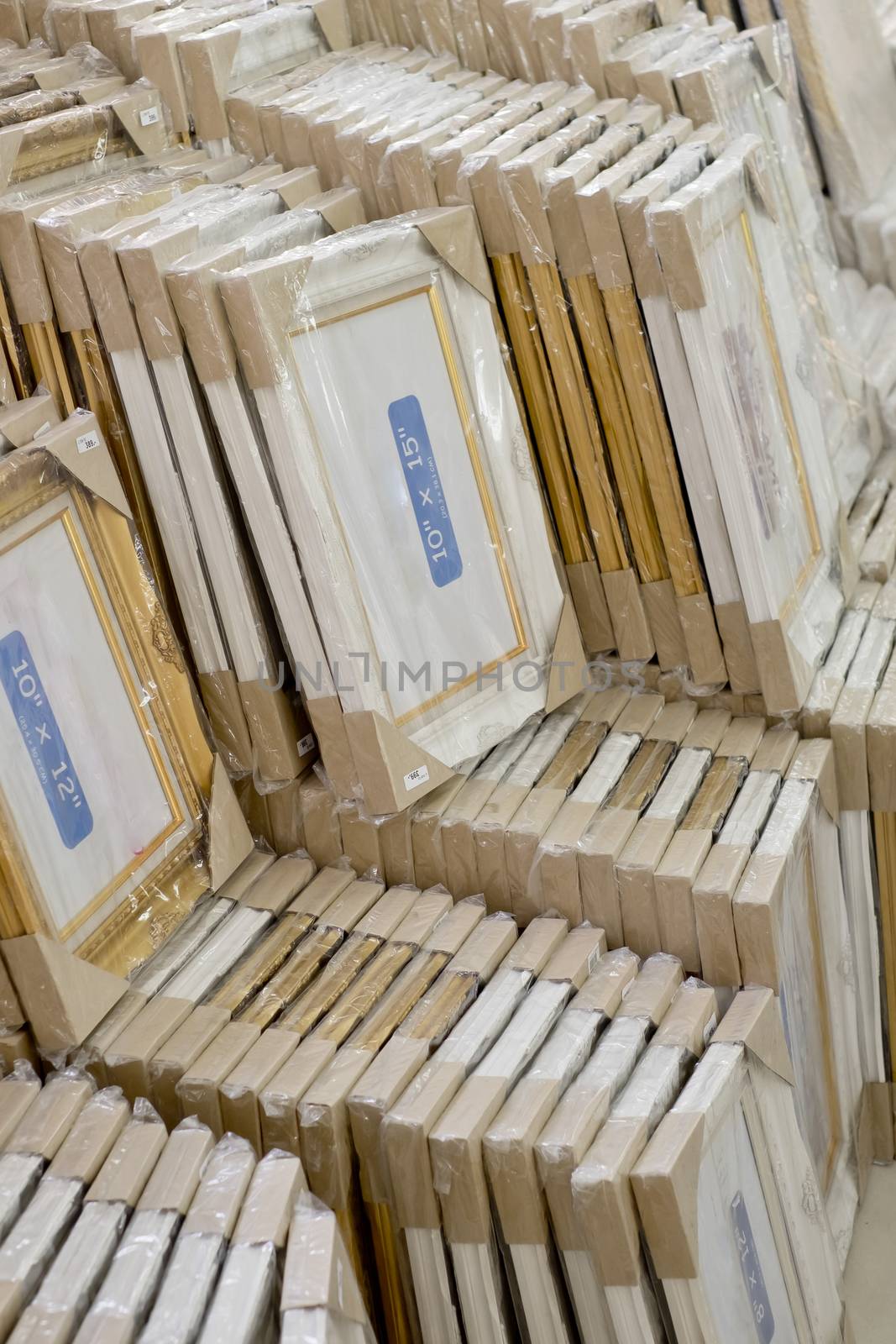 stack of picture frames in printing shop by art9858