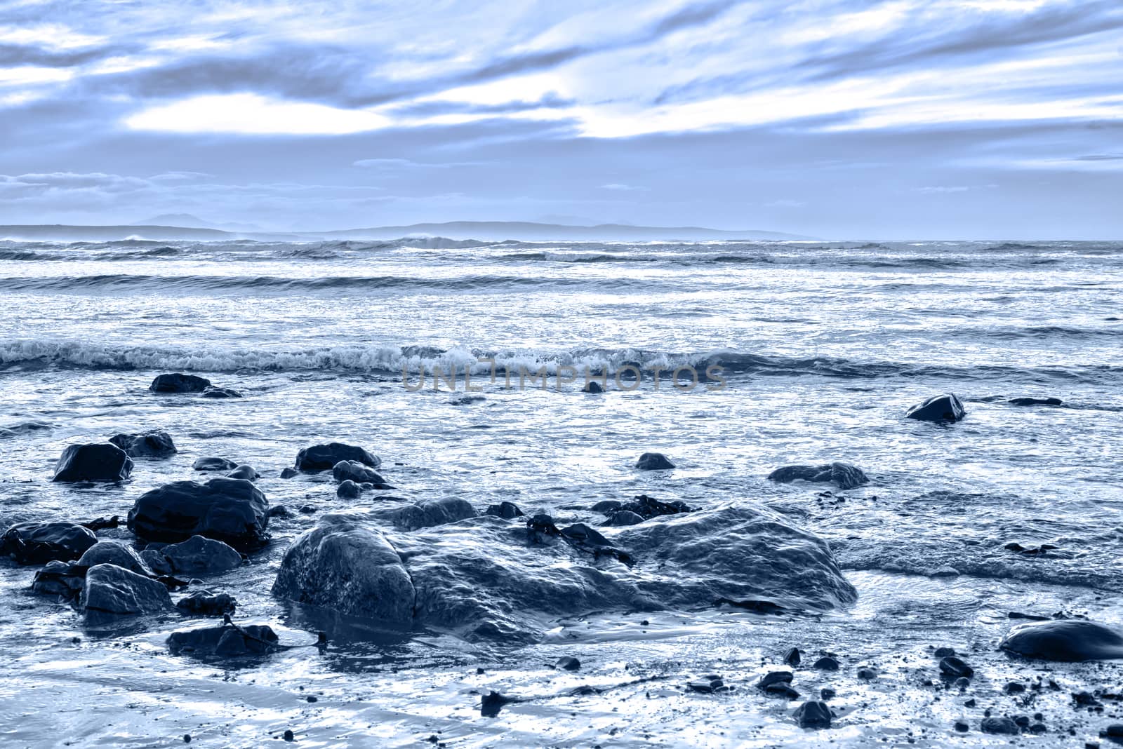 blue toned rocky beal beach by morrbyte