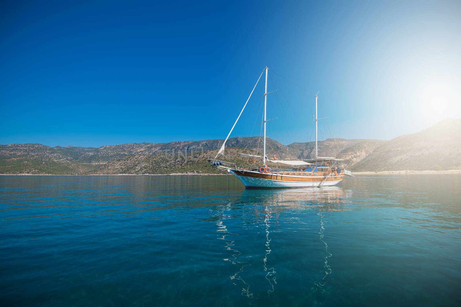 yacht on bay and castle in Kekova, near ruins of the ancient city on the Kekova island, Turkey