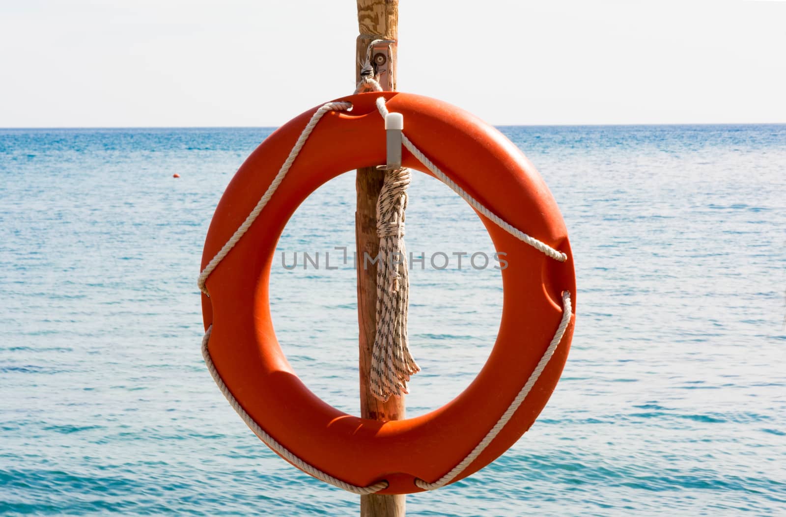 Lifebuoy with rope on the pole by Grommik