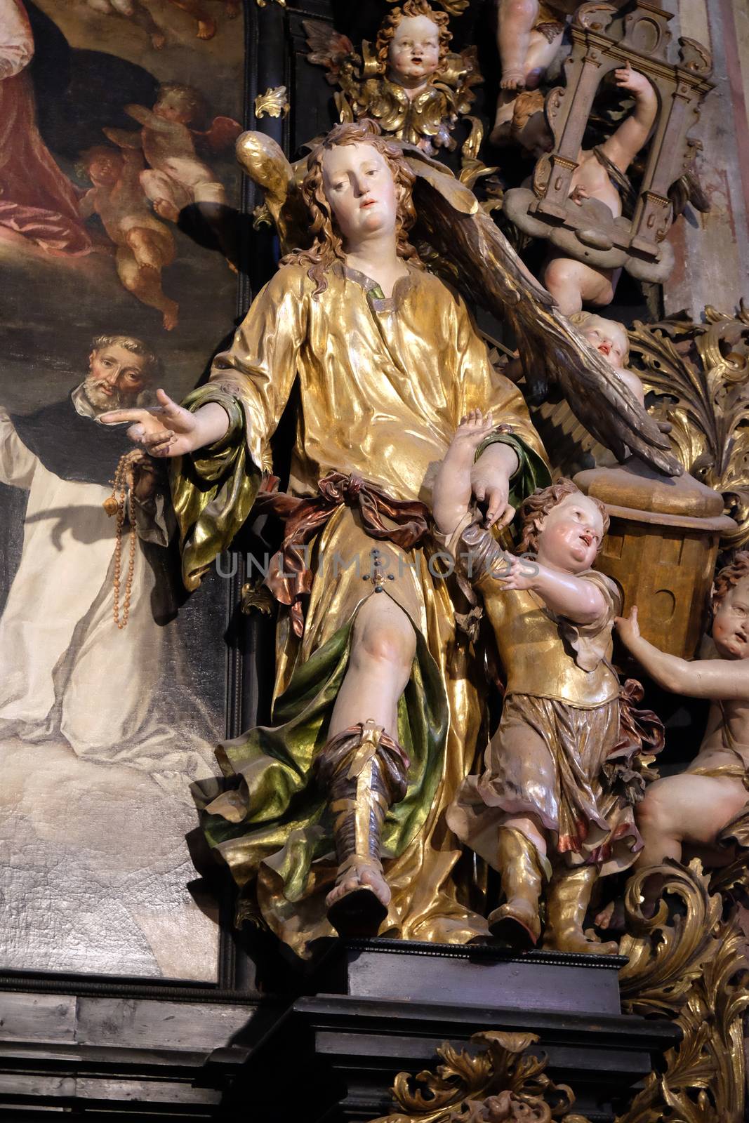 Archangel Raphael and Tobias on the altar of the Holy Rosary in Parish church in St. Wolfgang on Wolfgangsee in Austria