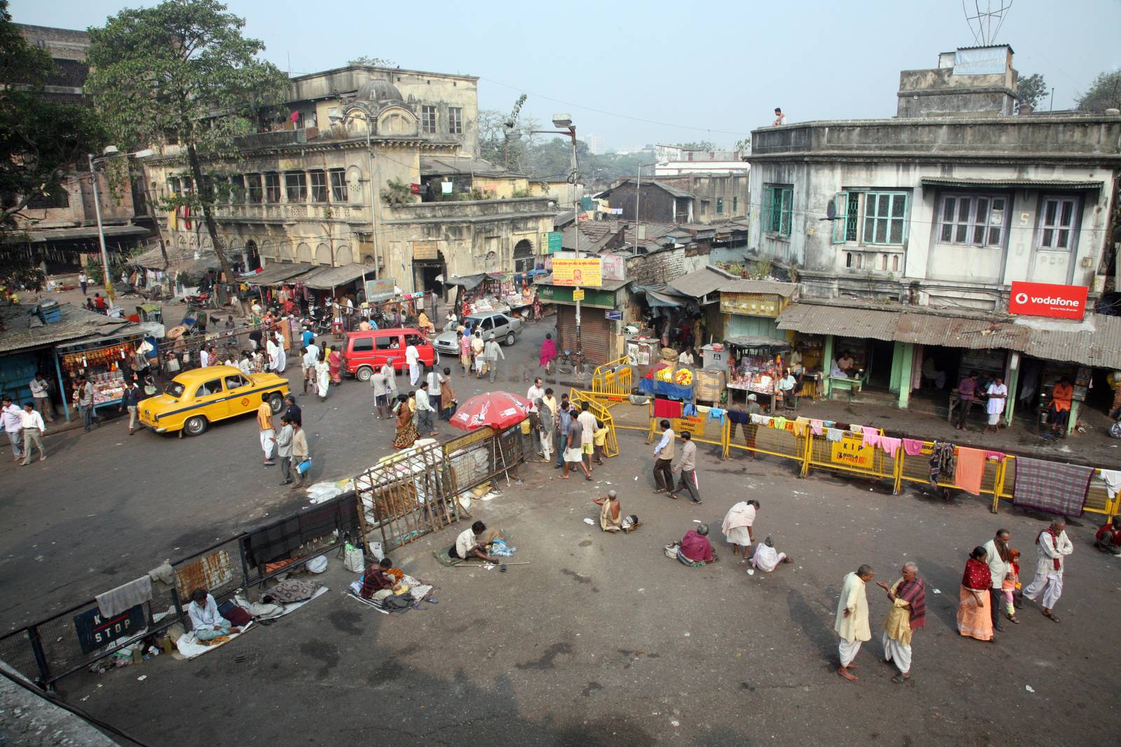 Tourists and visitors of famous Kalighat Kali Temple have rest near the shrine on January 24, 2009 in Kolkata. The name Kolkata to have been derived from the word Kalighat