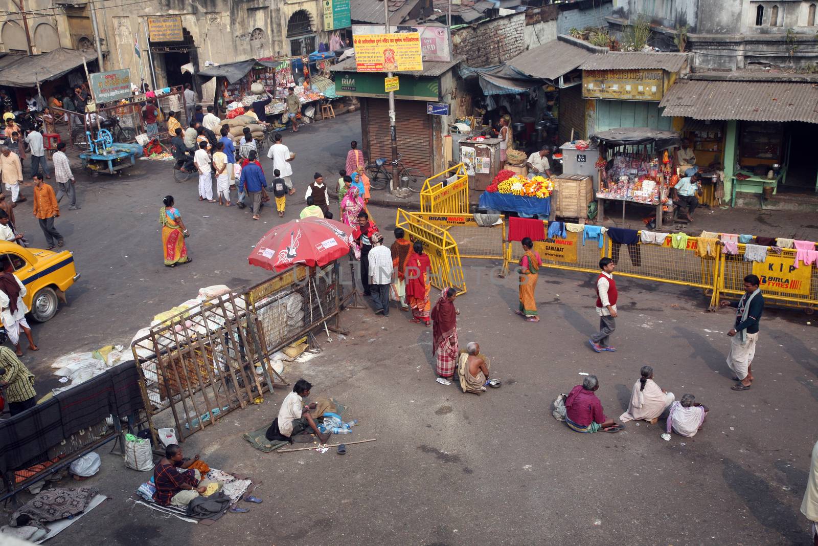 Beggars in front of Nirmal, Hriday, Home for the Sick and Dying Destitutes in Kolkata by atlas