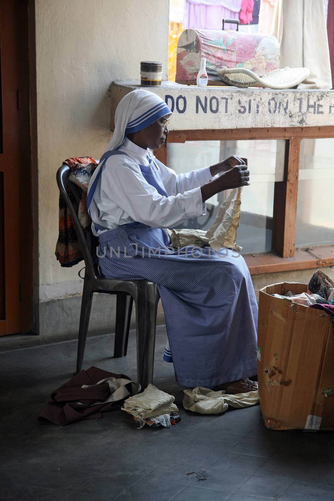 Sister of Missionaries of Charity classified the goods they have received from charitable organizations in Kolkata, India on January 24, 2009.