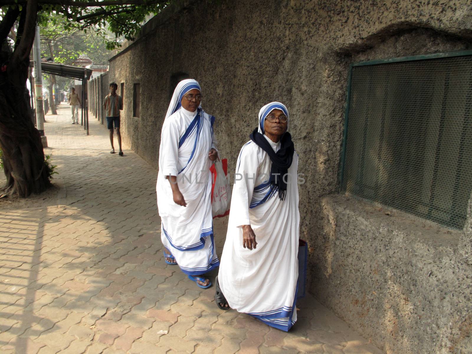 Sister of Missionaries of Charity at the streets of Kolkata by atlas