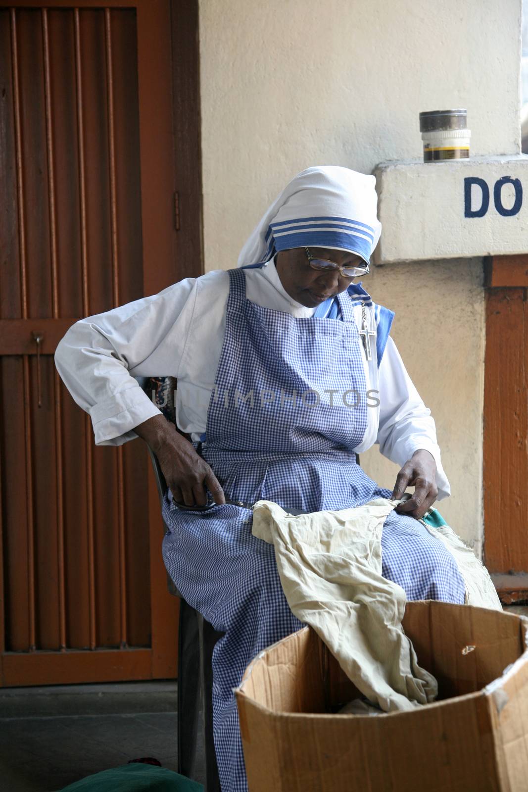 Sister of Missionaries of Charity classified the goods they have received from charitable organizations in Kolkata, India on January 24, 2009.