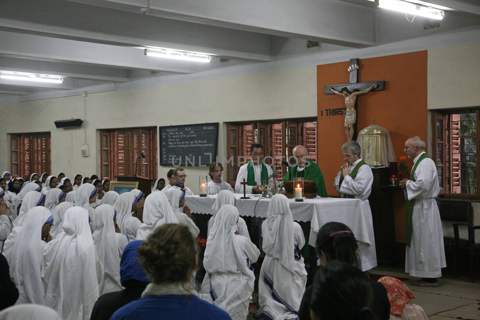 Sisters of The Missionaries of Charity of Mother Teresa at Mass in the chapel of the Mother House, Kolkata by atlas