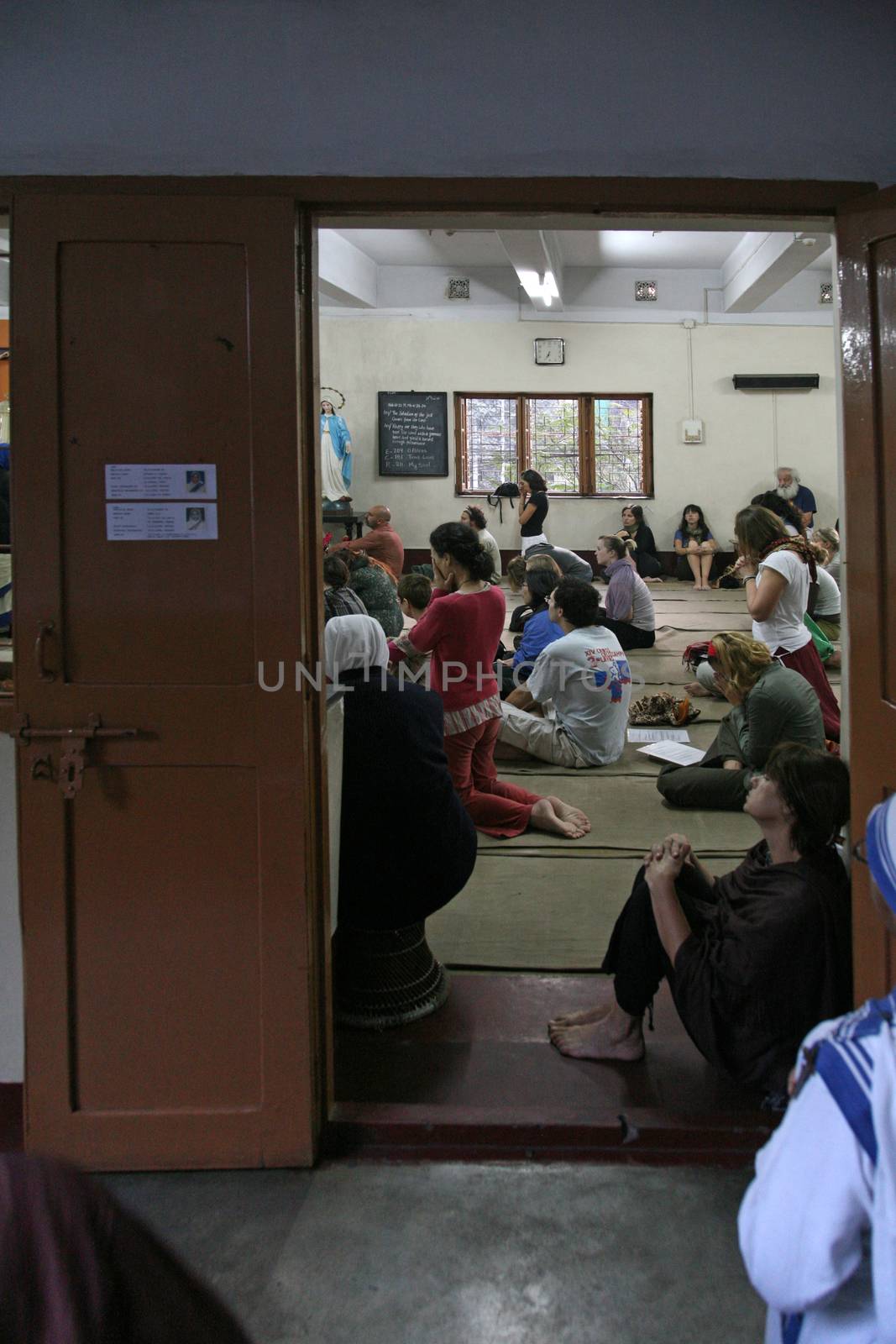 Sisters of The Missionaries of Charity of Mother Teresa at Mass in the chapel of the Mother House, Kolkata by atlas