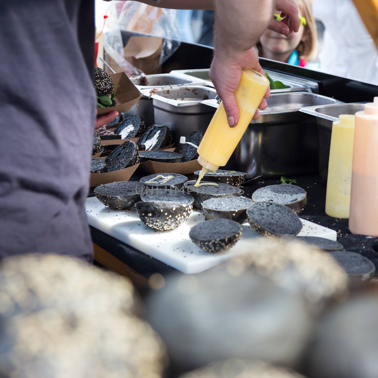 Burgers ready to serve on food stall. by kasto