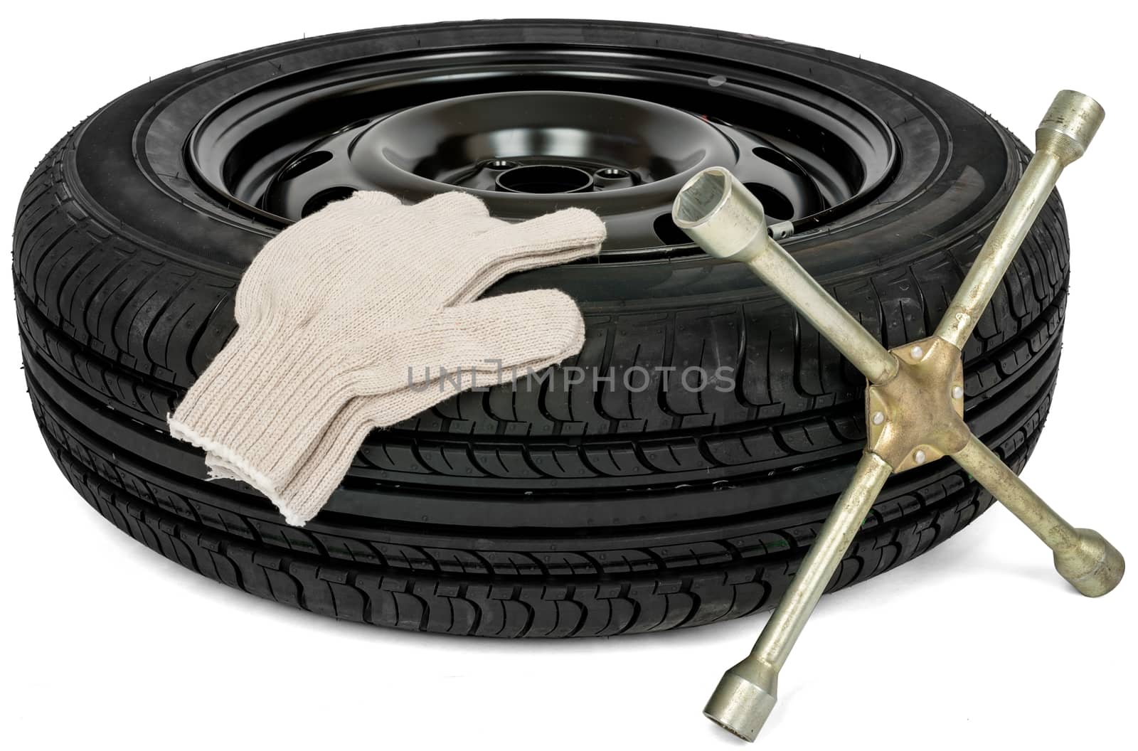 Car service. Tyre with screwdriver and white glove. Isolated