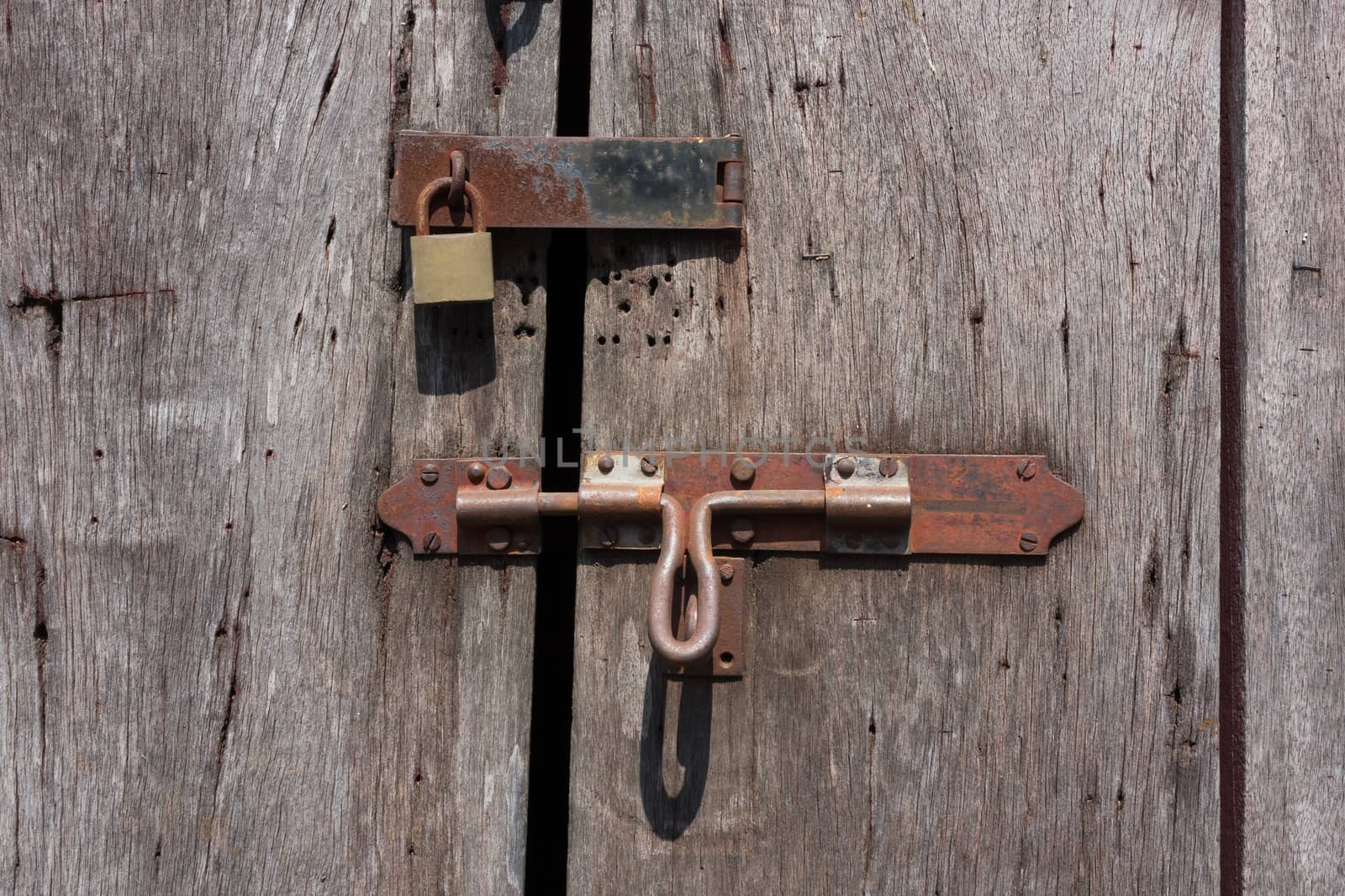 Closeup wooden door with lock by koson