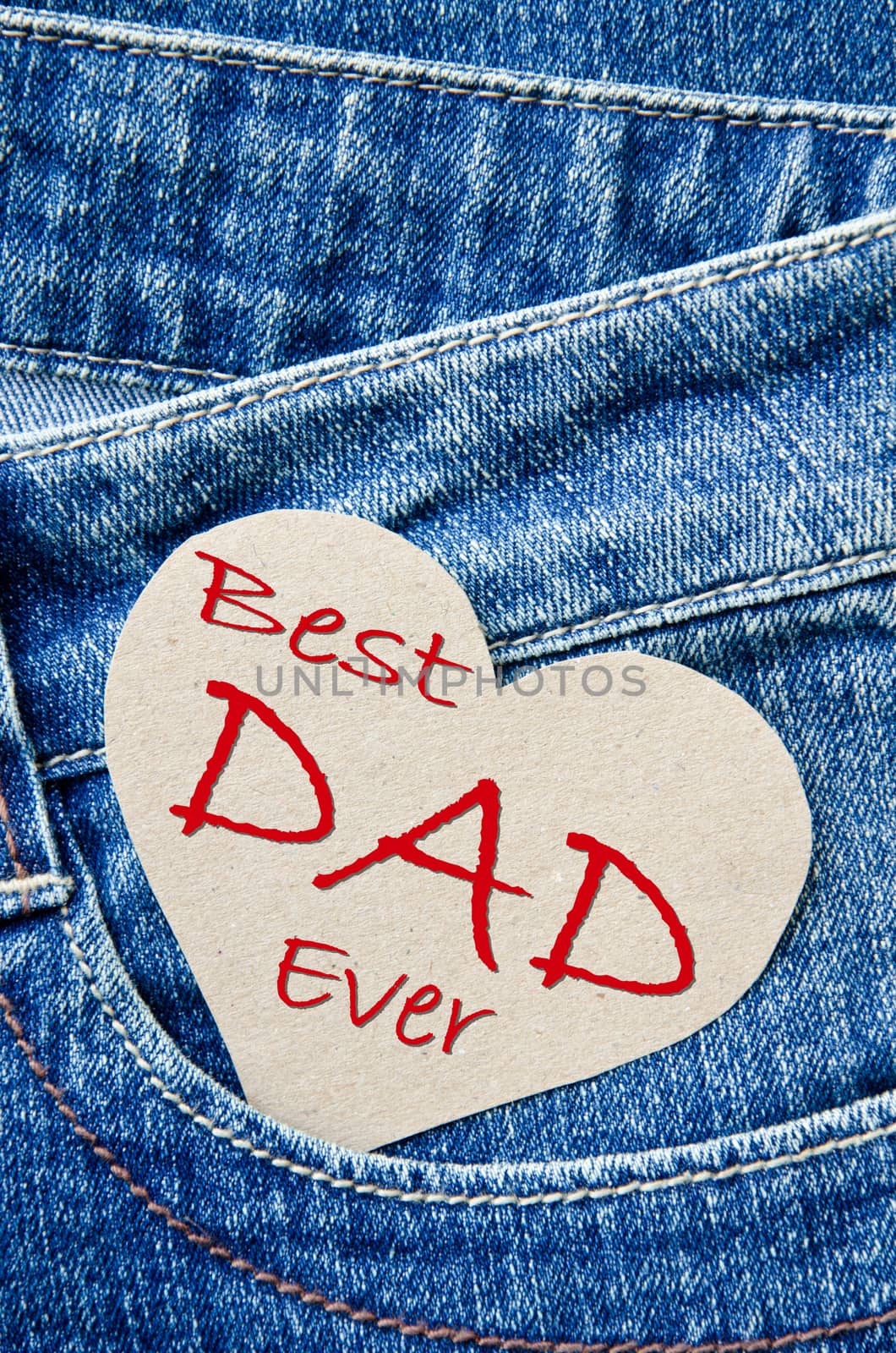 Greeting Card for Father's Day. Top view image of fathers day on blue denim jeans.