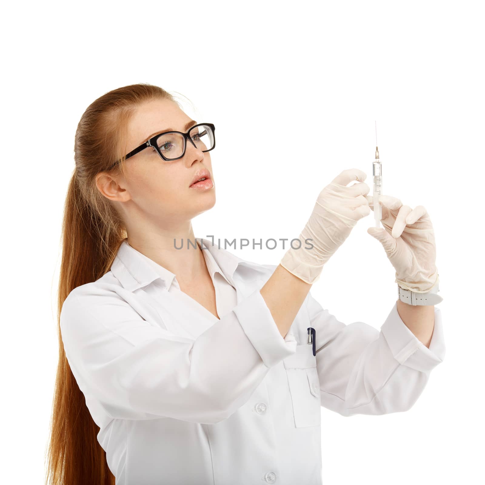 Portrait of an attractive young woman doctor with a syringe in his hand over white background