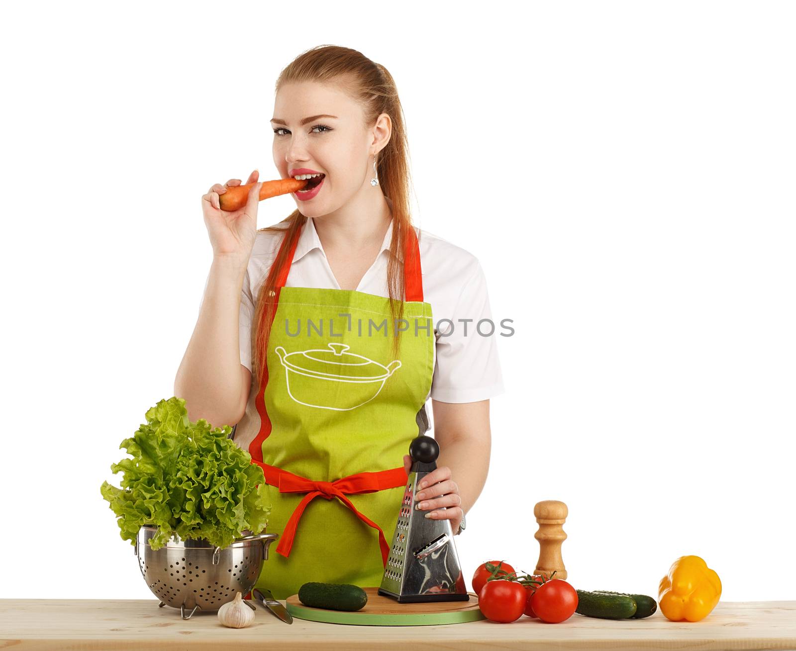 Beautiful sexy young woman cooking fresh meal isolated on white background