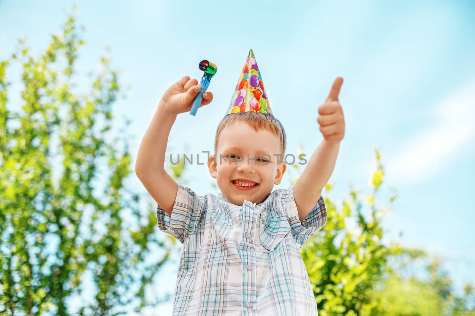 Little boy gesturing and having fun celebrating birthday. Positive emotions.