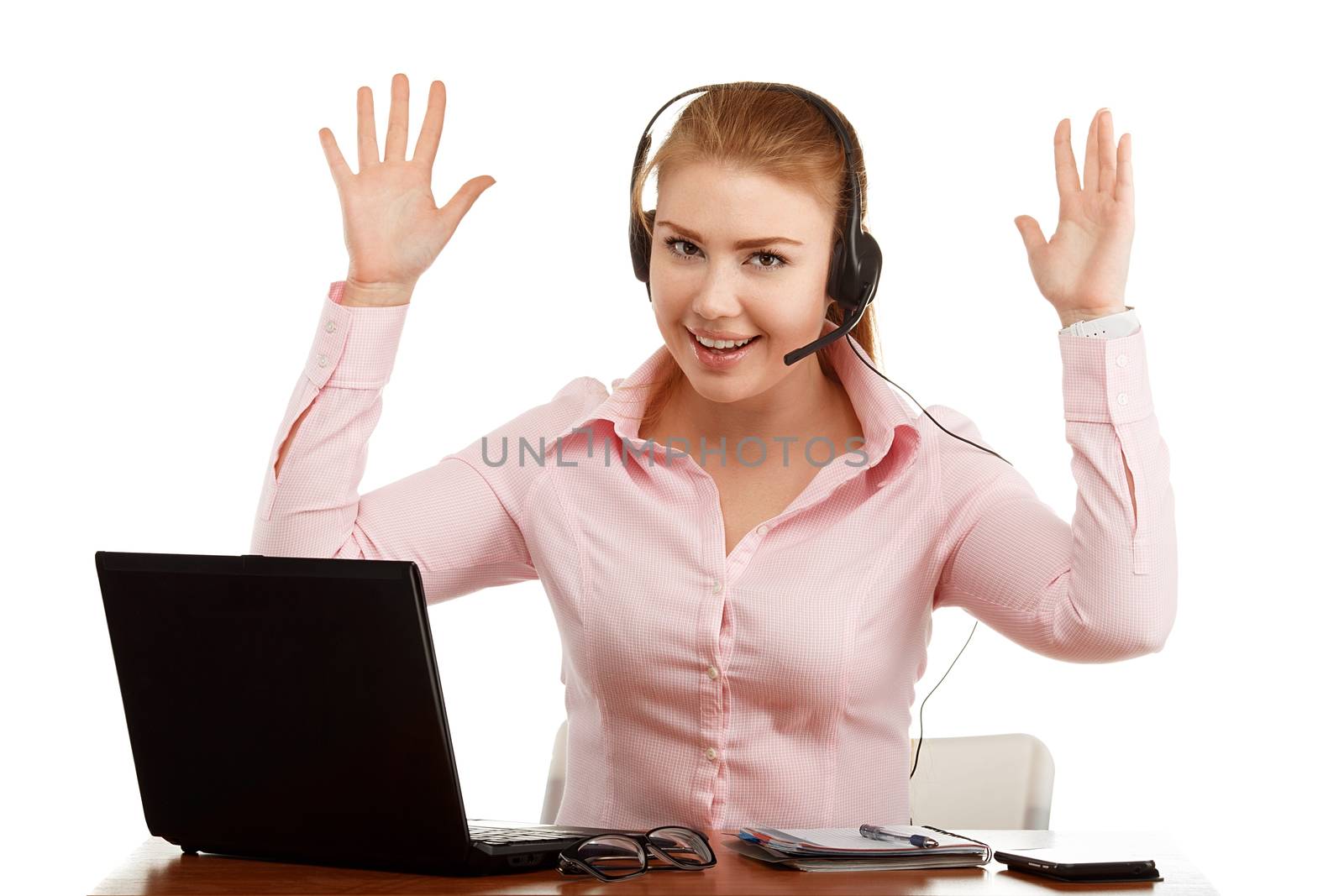 Portrait of office worker at a desk with a computer isolated on white background