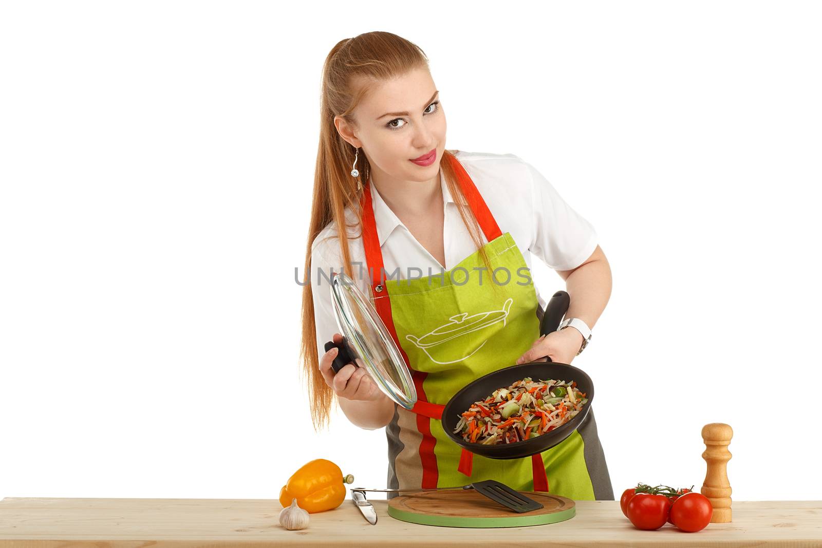 Beautiful sexy young woman cooking fresh meal isolated on white background