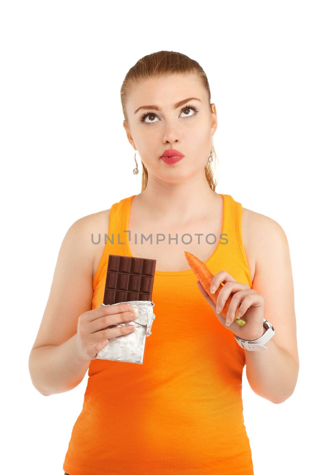 Portrait of a pretty girl having a dilemma with her diet. Concept of healthy nutrition.