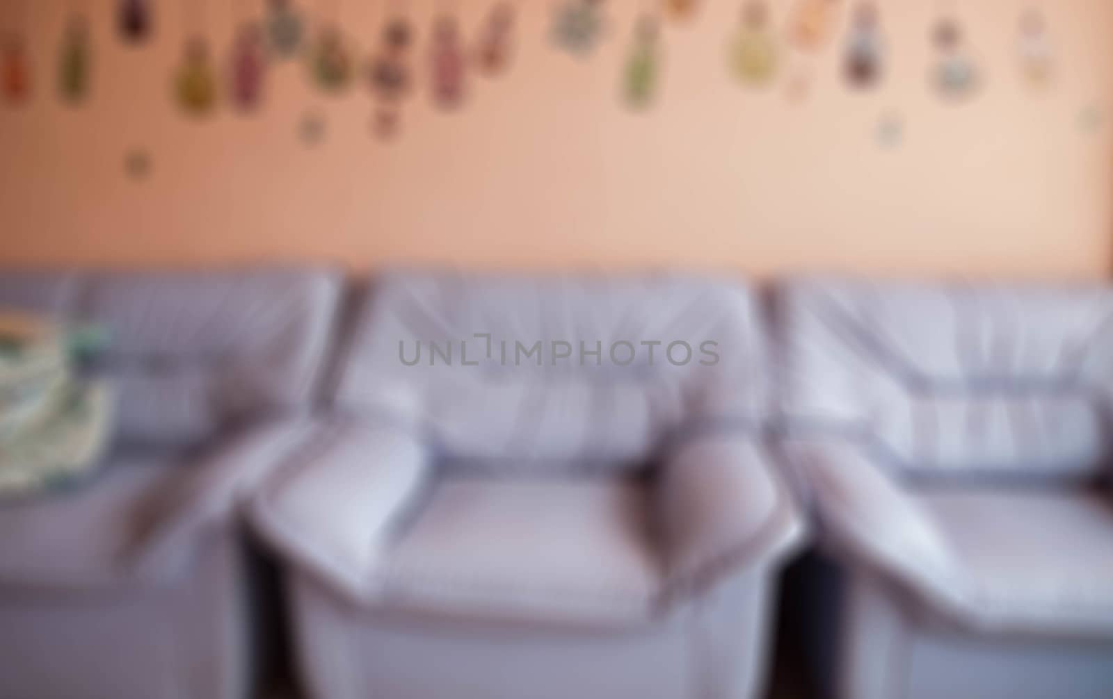 Sofa purple pink background blur.