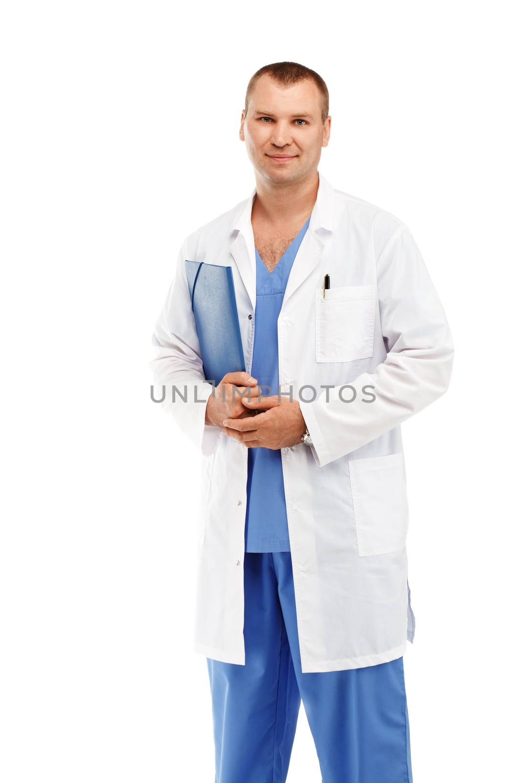 Portrait of a young male doctor in a white coat and blue scrubs against a white background