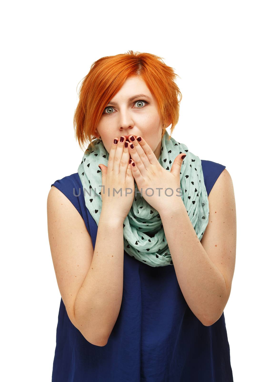 Close-up portrait of a funny red-haired girl emotionally gesticulating and waving his hands isolated on white background