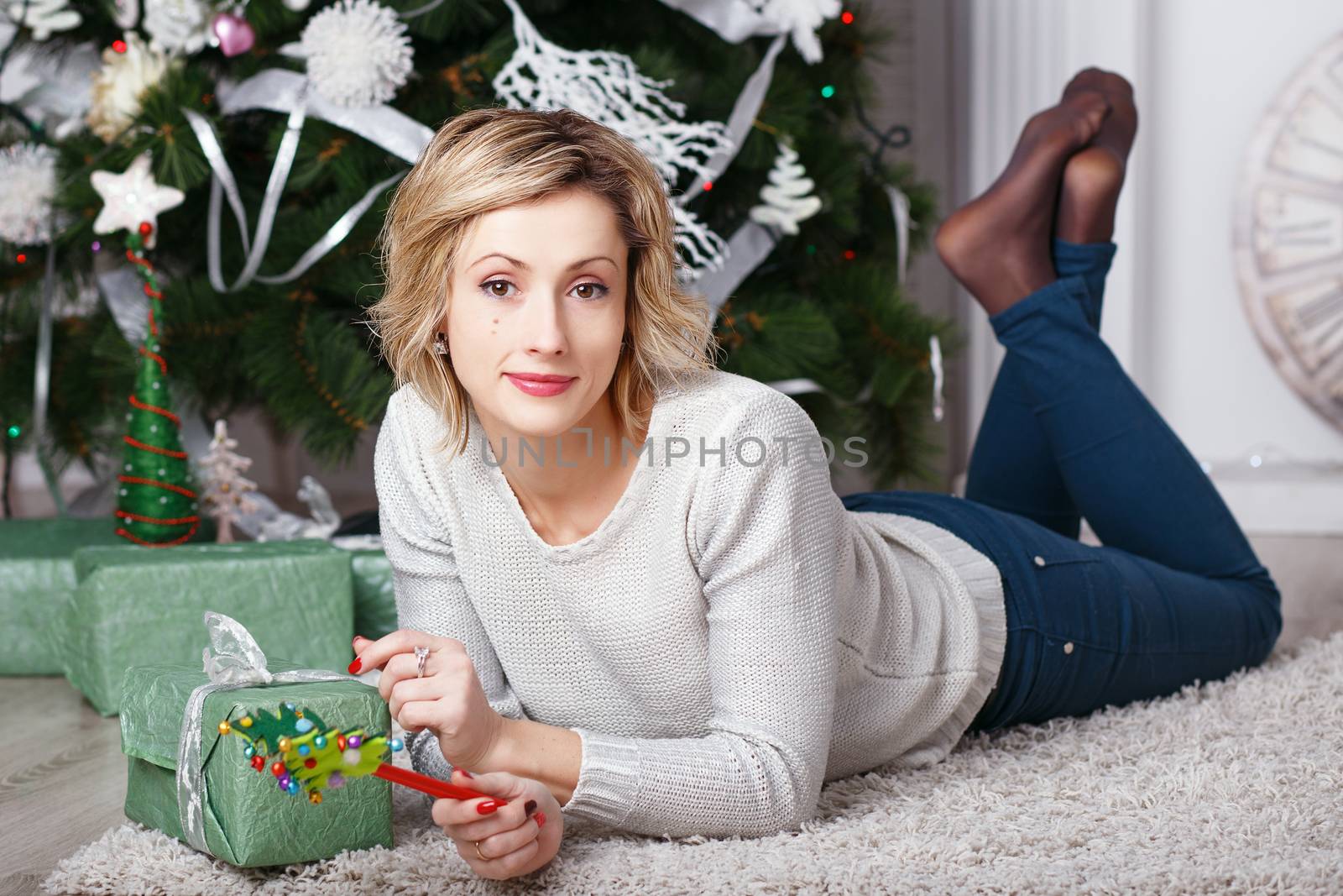 beautiful woman in the interior with Christmas decorations. by natazhekova
