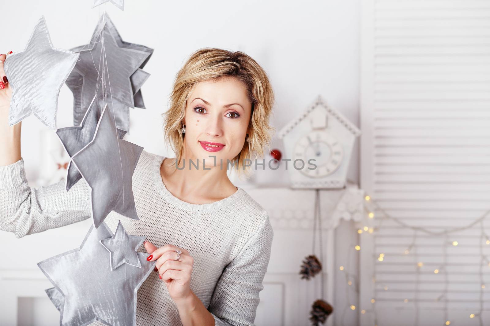 Portrait of a beautiful woman in the interior with Christmas dec by natazhekova