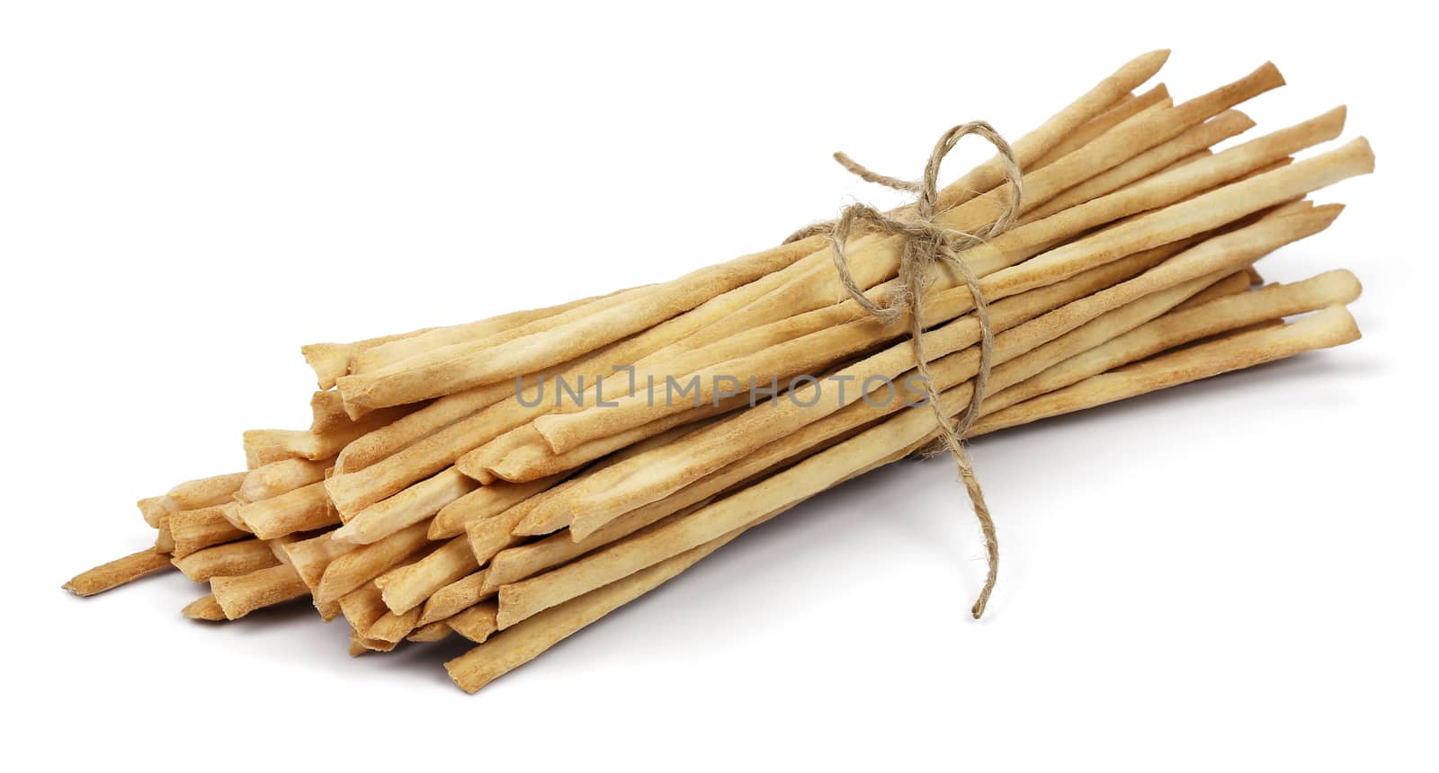 Crispy crunchy long bread sticks tied with rope, isolated on a white background.