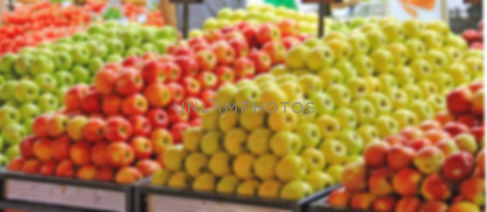 apples on the counter retail sales, green and red fruits for healthy pitaniyamyagky focus blurred background