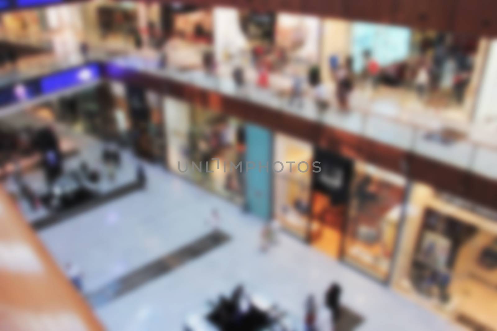 shopping center, view from the top inside, boutiques and people make purchases, blurred