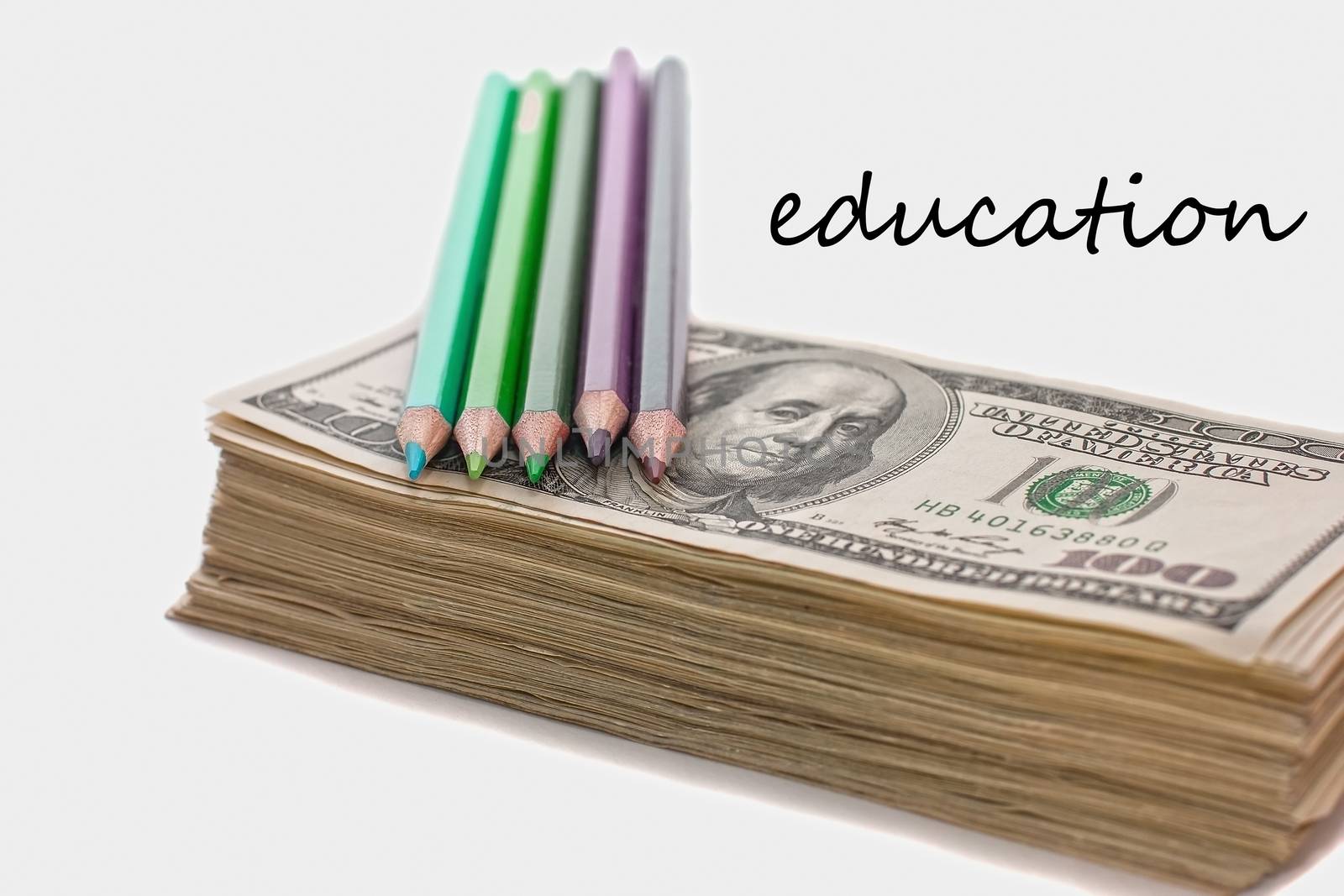 education has a price, the money allocated for education, investment in knowledge, dollars and pencils, scholarship, very soft focus