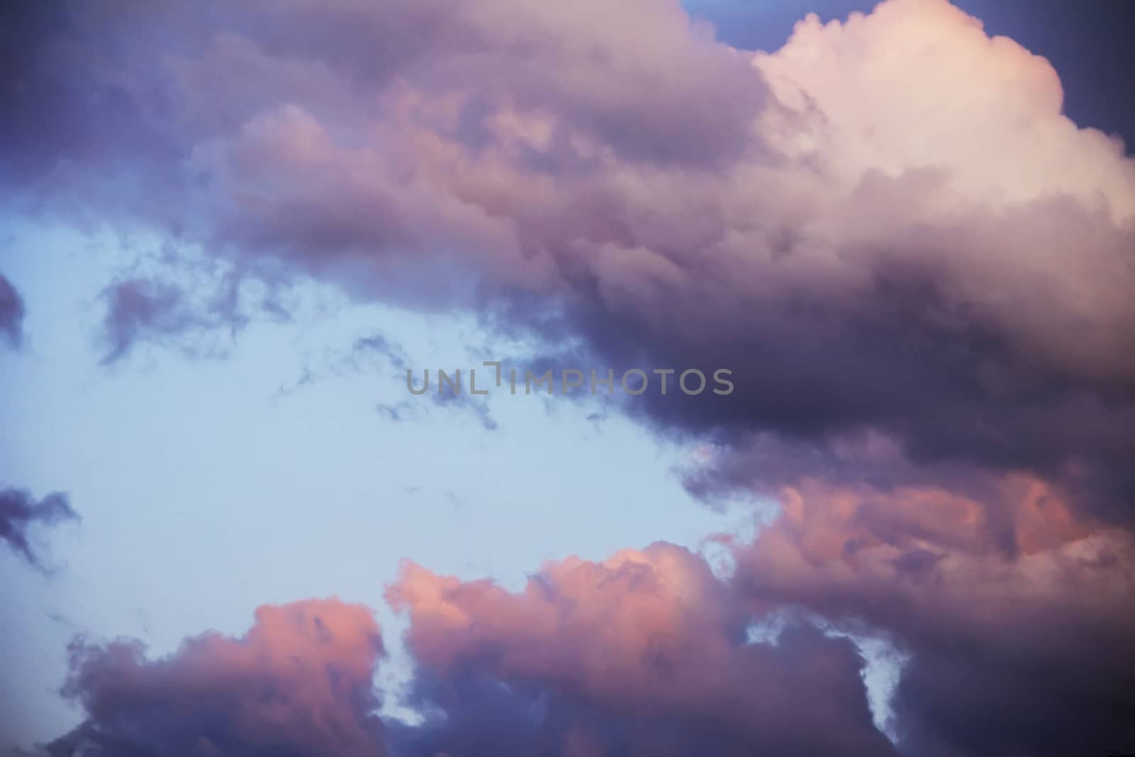 colorful dramatic sky with clouds at sunset for background and texture