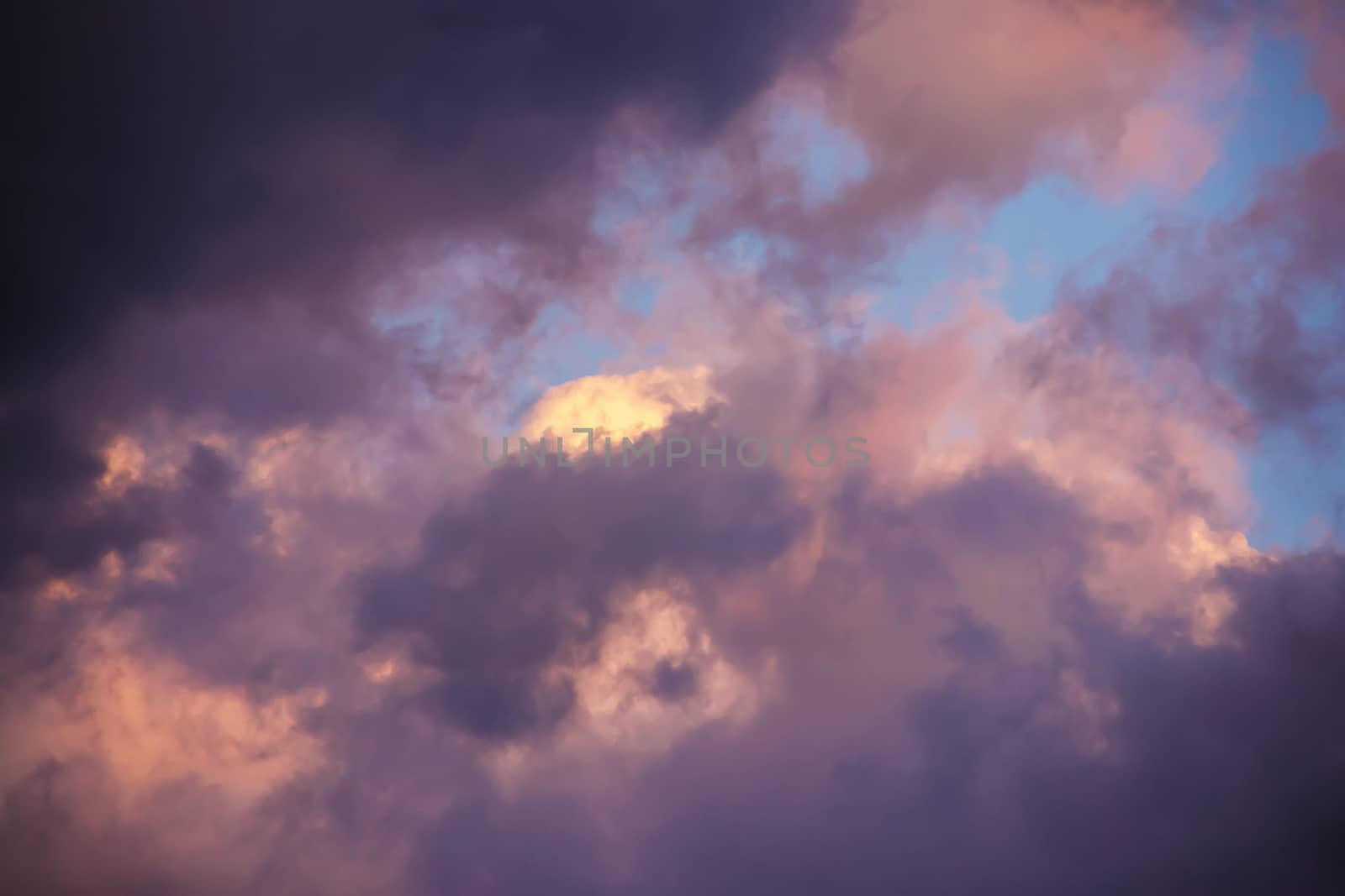 colorful dramatic sky with clouds at sunset for background and texture