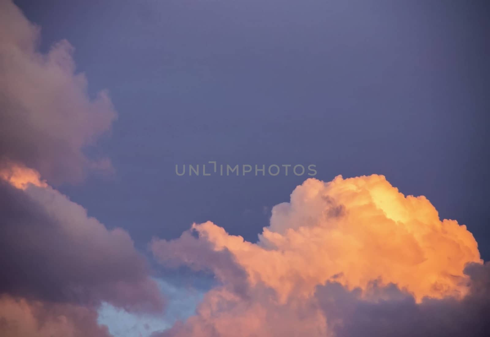 colorful dramatic sky with clouds at sunset for background and texture