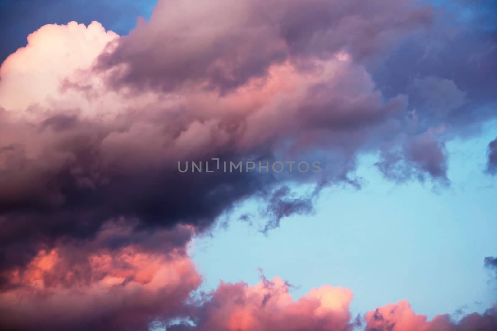 colorful dramatic sky with clouds at sunset for background and texture