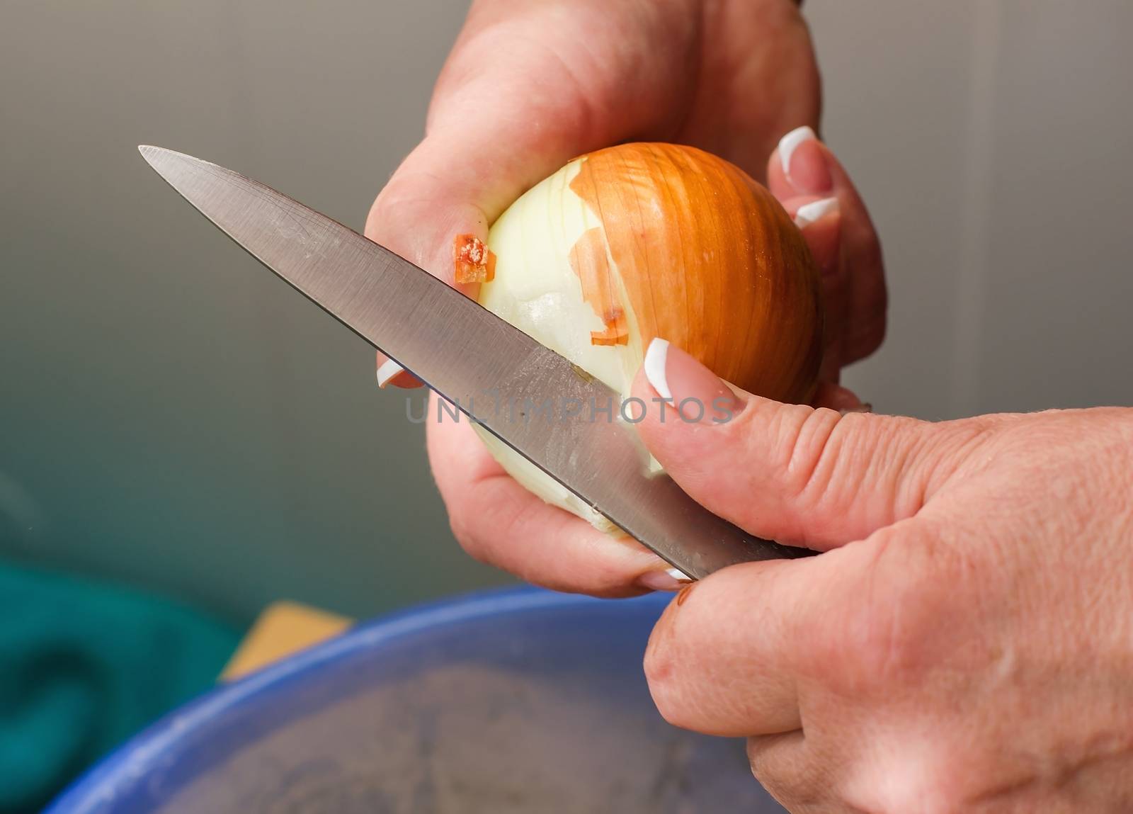 closeup hands clean onions, cleaning raw fresh onion, cooking in by KoliadzynskaIryna