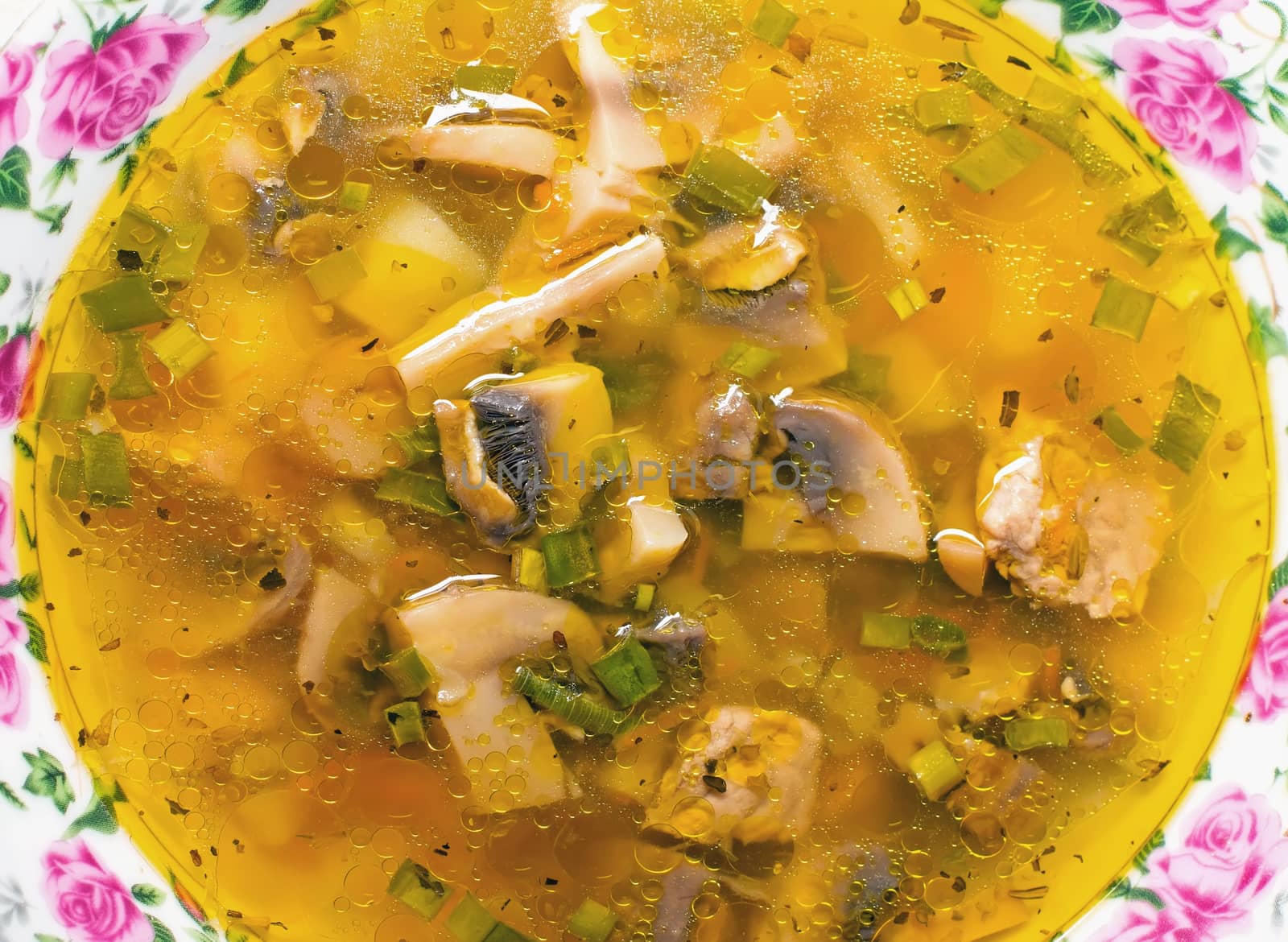 soup in a bowl with fresh champignons