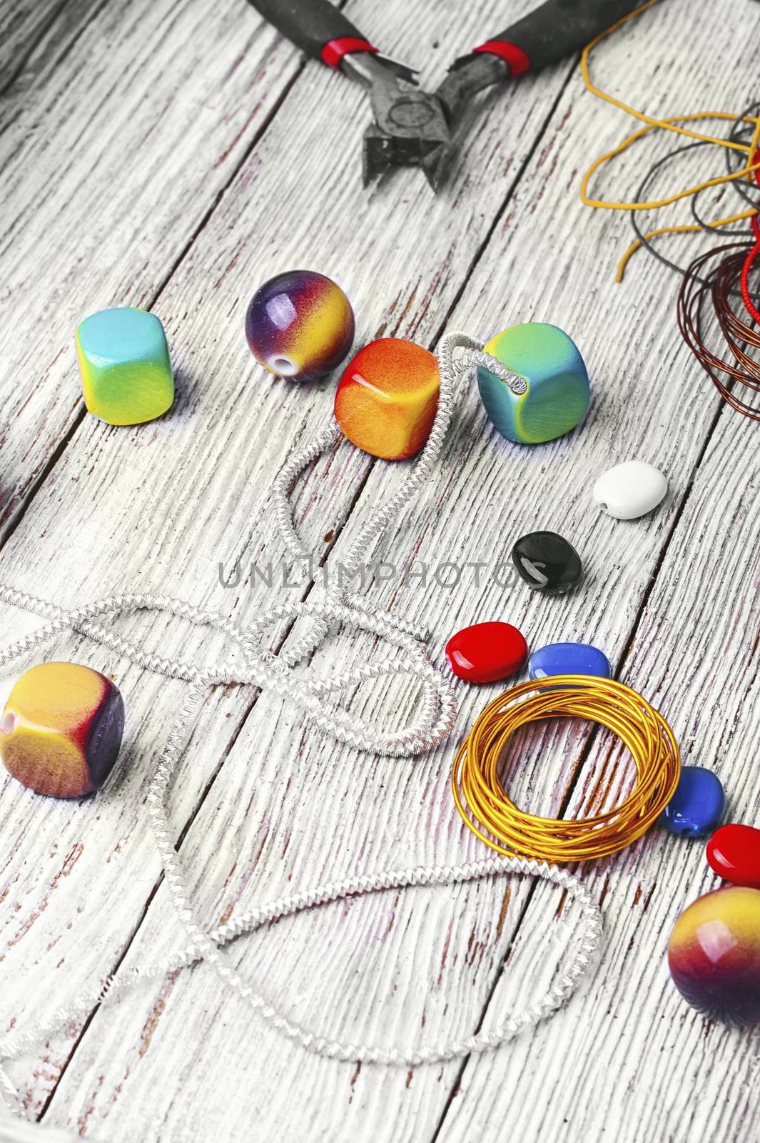 chain,pair of scissors and set of beads for jewelry