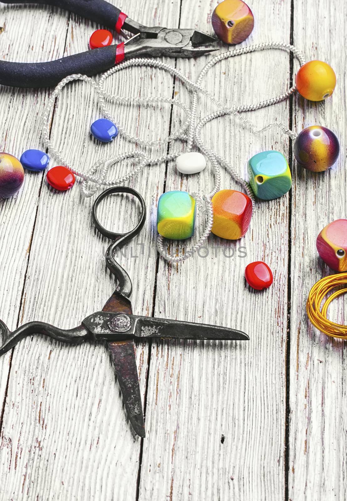 chain,pair of scissors and set of beads for jewelry