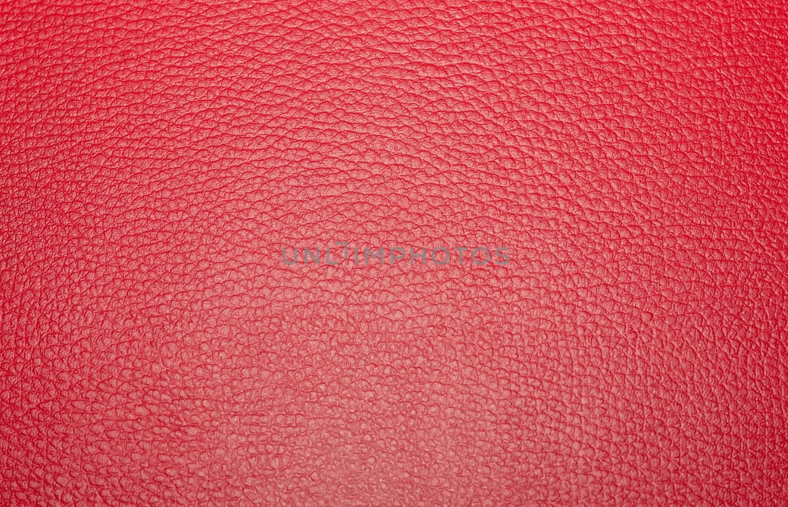 Texture colored leatherette red, for design and upholstery for decoration and fashion, for the background and tukstur