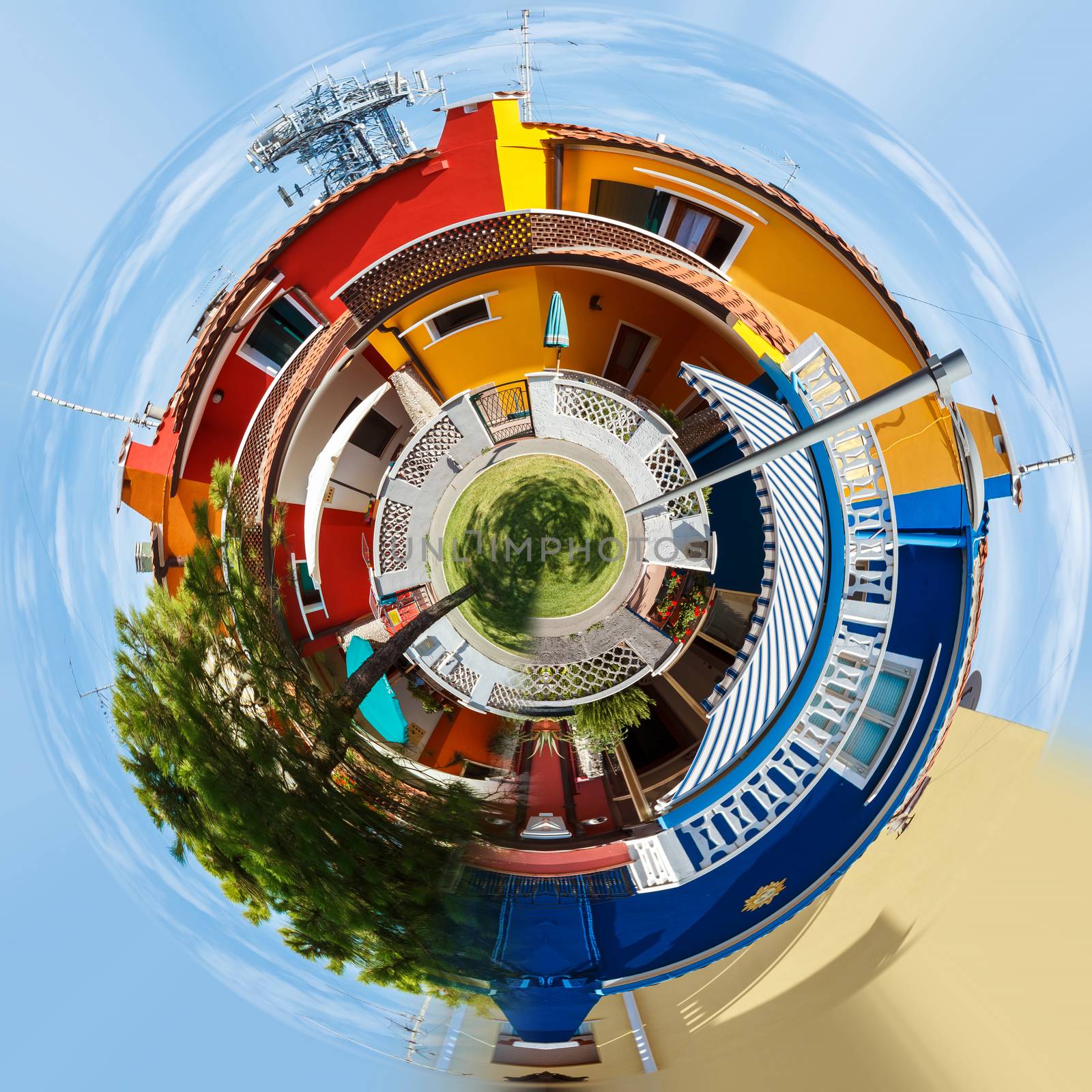 Planet of Colorful buildings in street, Italy, Caorle sunny day. Little planet concept. Tiny green projection 