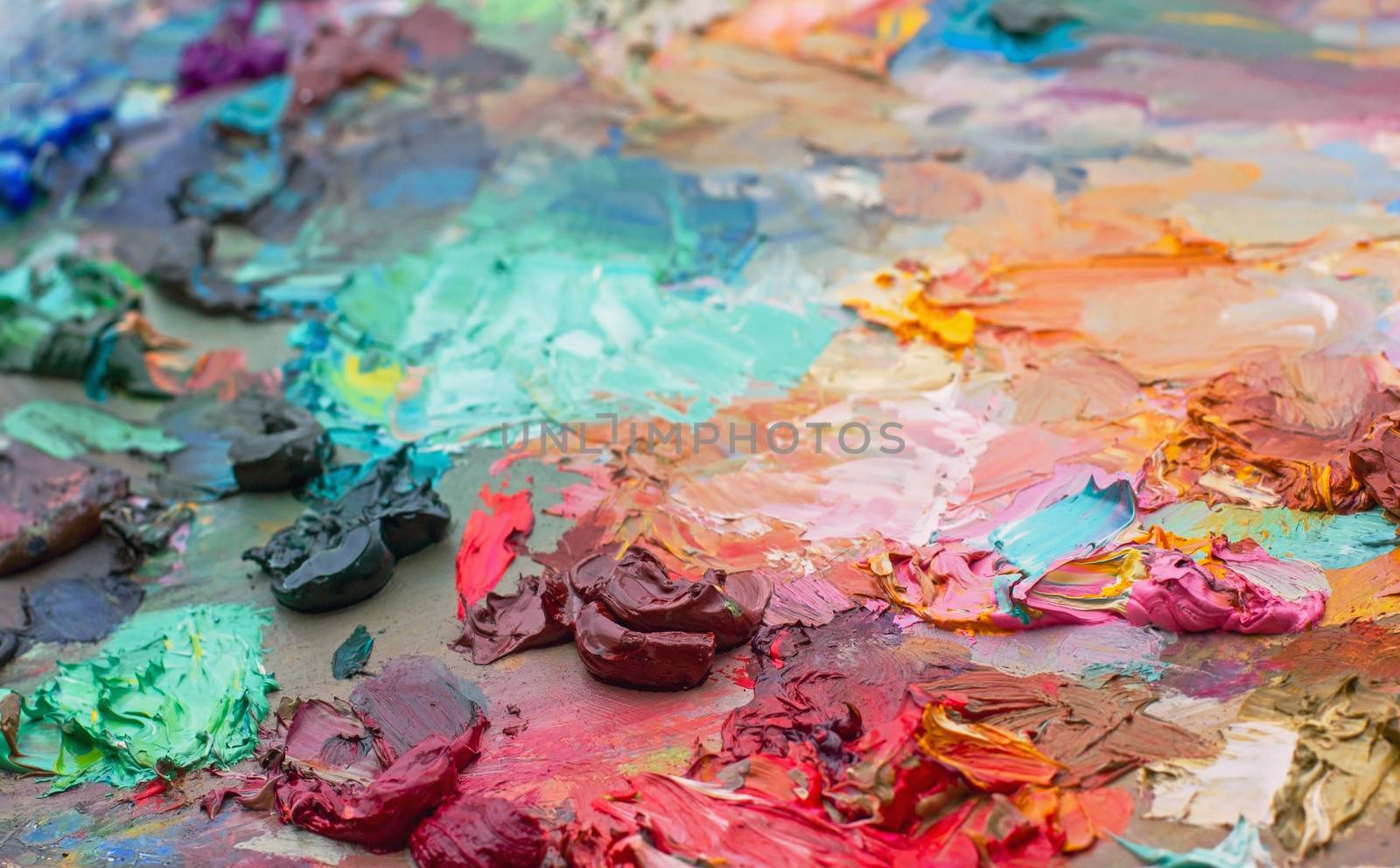 artist's palette with paints used in the brushes palette oil paint for drawing and painting