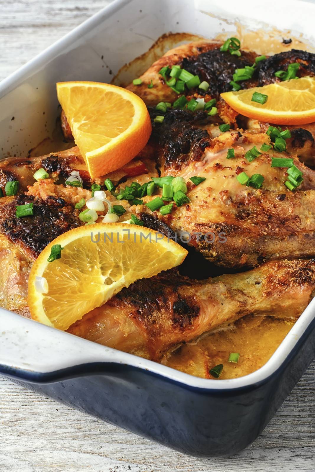 Chicken breast baked with oranges in the oven