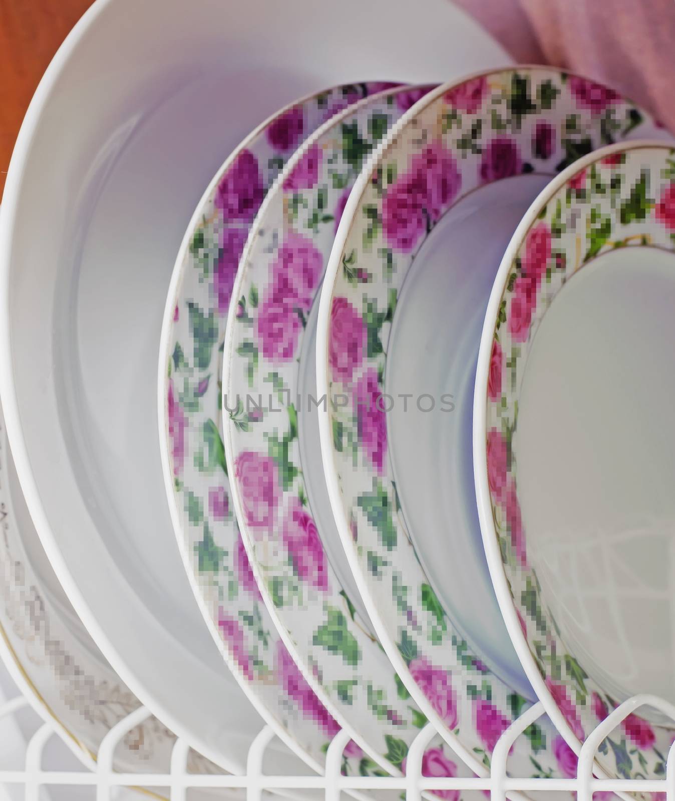 Washed plates stacked vertically by KoliadzynskaIryna