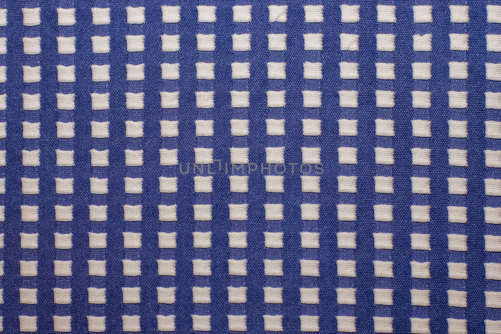 knitted fabric with square patterns, knitted wool textiles, warm clothes for winter fabrics for texture and background