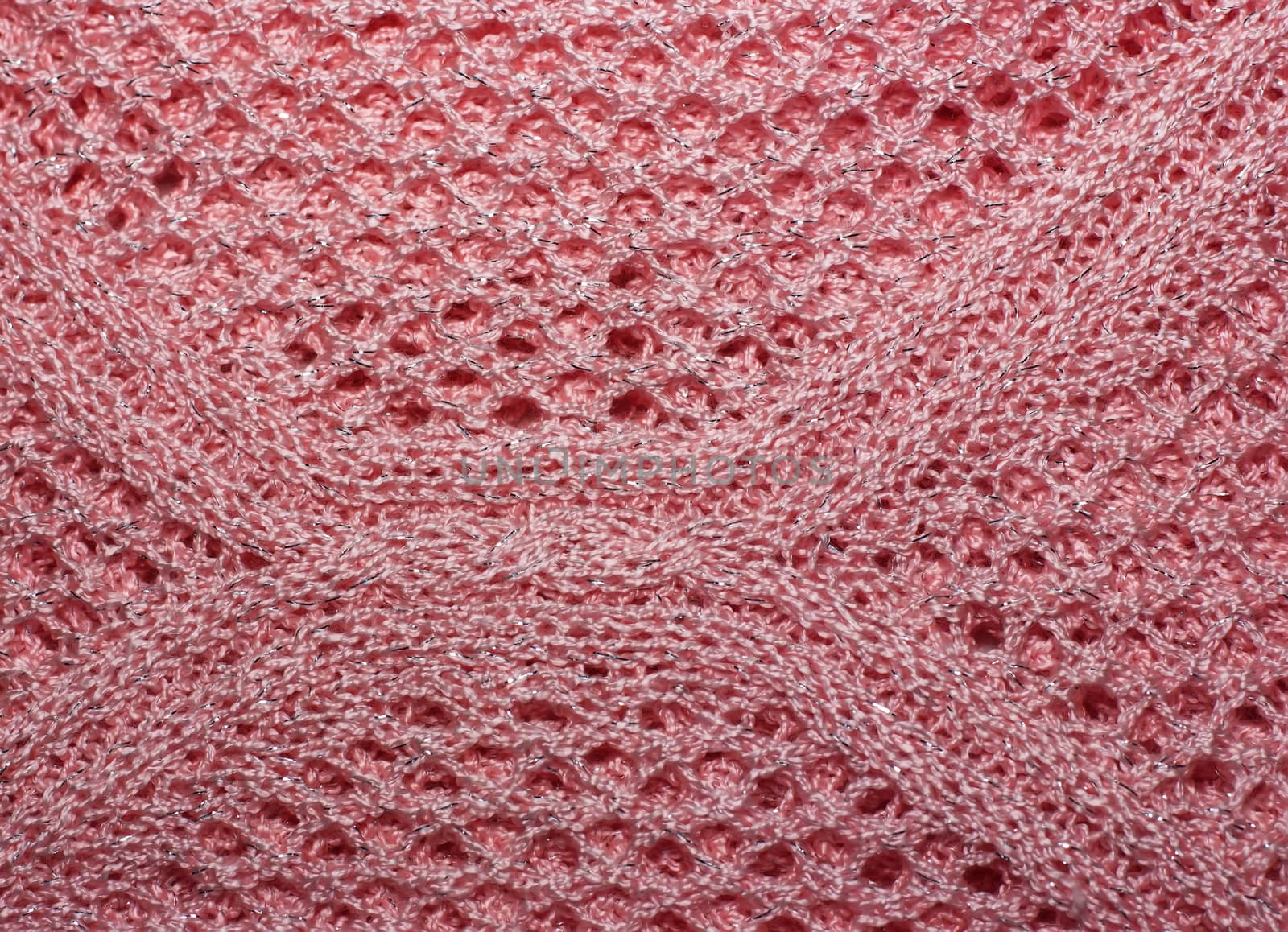 Pink knitted wool fabric texture closeup. with lurex thread, Jersey Knitted background with a relief pattern