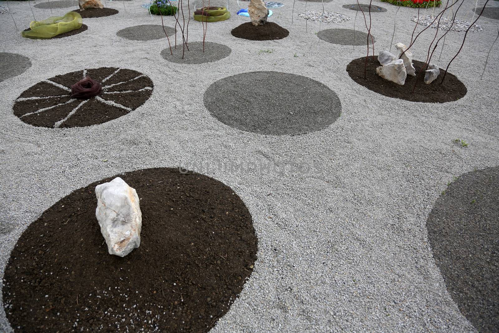 Garden design, with hard landscaping, using shaping, paving, rocks and pebbles