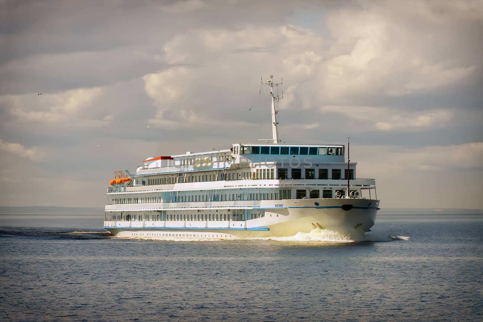 Cruise ship in open water front view