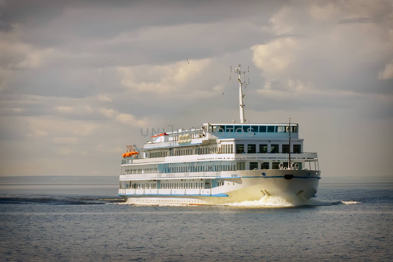 Cruise ship in open water front view