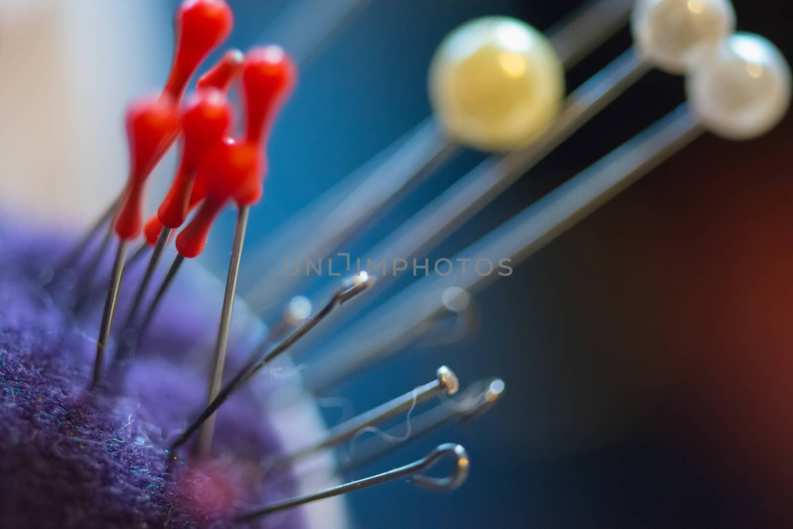 Set of threads in the bobbin on colorful background.